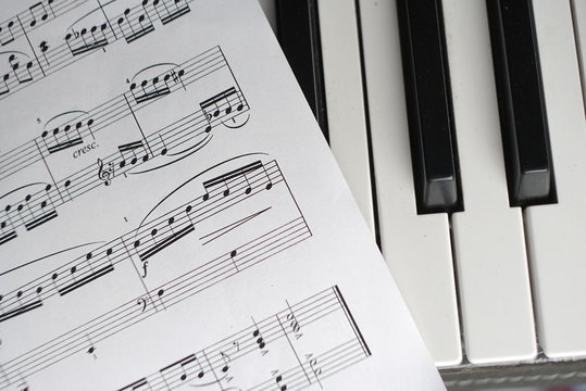 sheet music and piano keyboard