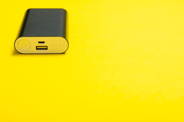 Power bank charger energy on yellow background