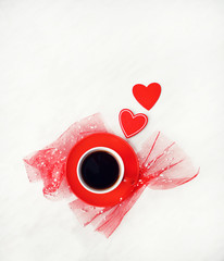 red cup of fresh black coffee and hearts on light background. Romantic minimal composition, Valentine's day concept. top view, copy space.  template for design