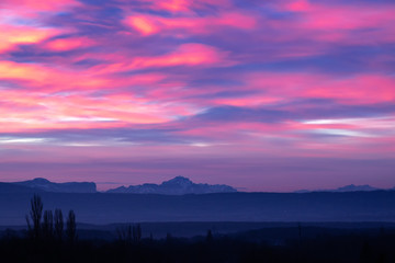 Morning sky with different colors. Colorful dawn in the mountains.
