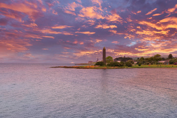 Fototapeta premium Looking over to Largs from the Yachthaven as the sun goes down in the West