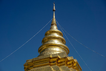 Fototapeta premium Golden pagoda against the sky