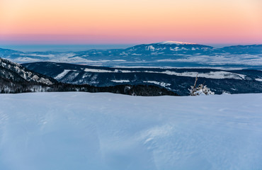 Fototapeta na wymiar View of Babia Gora (Babia hora), the highest peak in the Zywiec Beskids at sunrise in winter scenery. A wonderful landscape.
