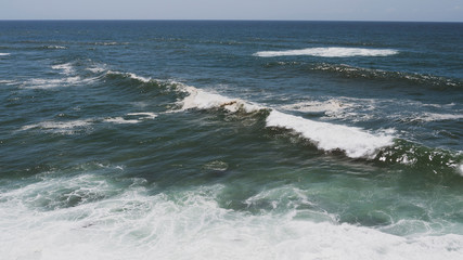 Large ocean waves crashing, on a sunny day. Taken in Portugal.