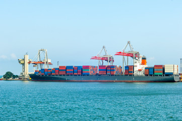 Unloading freight from container ship in Odessa port terminal, Ukraine