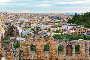 Fototapeta na wymiar Scenic view of ancient ruins of the Odeon of Herodes Atticus. It is a small building of ancient Greece used for public performances of music and poetry, below on the Acropolis hill. Athens, Greece