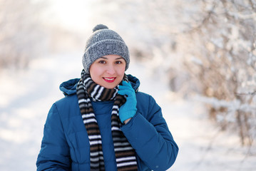 portrait of a young happy girl woman in winter clothes