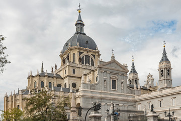 Fototapeta na wymiar Main Cathedral called Almudena in Madrid, Spain. Almudena Cathedral (Catedral de Santa Maria la Real de la Almudena) near the Royal Palace in Madrid, Spain