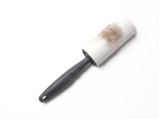 Cleaning roller with tape for cleaning clothes or fabric with animal fur. Isolated white background
