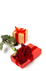 Composition of red roses and gift boxes