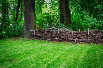 Natural fence made of twigs and branches