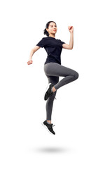 Fototapeta na wymiar Full length portrait of fitness woman in sportswear jumping.