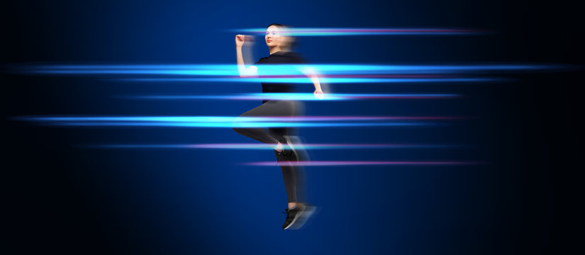 Full length portrait of fitness woman in sportswear jumping.