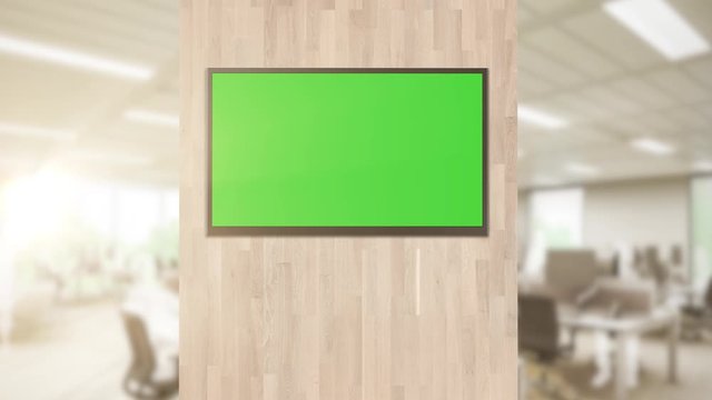 In the corporate office of the conference room there is a green layout of the TV screen or an interactive Digital Board in horizontal mode
