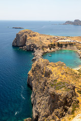 Scenic view from the acropolis of Lindos at the coastline of the mediterranean sea and St. Pauls bay