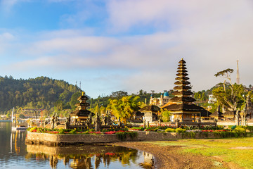 Naklejka premium Pura Ulun Danu Bratan, Hindu temple on Bratan lake morning landscape, one of famous tourist attraction in Bali, Indonesia