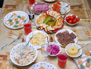 Table with food for the holiday with fruit salads and drinks