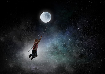 Fototapeta na wymiar Kid boy catching moon. Mixed media