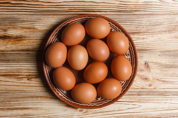 eggs in a basket on wooden table