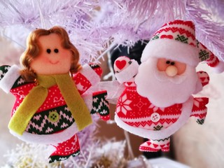 Angel and Santa on white christmas tree in celebration picture