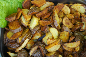 fried potatoes on the grill. street market