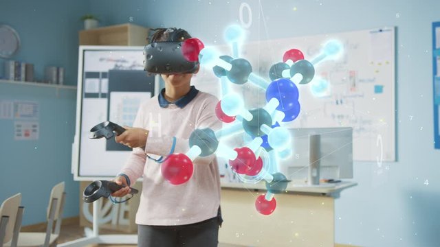 Cute Girl Wearing Augmented Reality Headset and Using Controllers Interacts with 3D Molecule. Futuristic School Science Class for Children Learning in STEM Programs. VFX, Special Effects Render