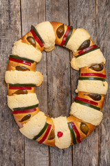 Kings day bread also called epiphany cake on wooden background