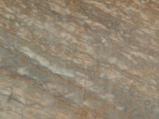 Marble background with brown texture. Stone kitchen countertop with natural pattern. Ceramic tile for interior and exterior decoration. Brown marble backdrop