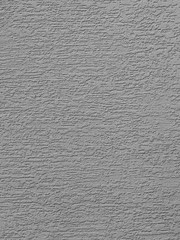 Silver background facade plaster . Monolithic plaster decorative backdrop. Single layer scraped cement plaster wallpaper. Exterior building structure backdrop. Silica sand cement wall plaster