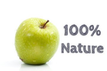 100% Nature words written on isolated background with fresh green apple