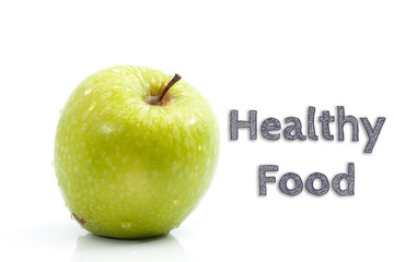 Healthy Food words written on isolated background with fresh green apple