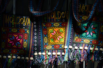 Moldovian colorful bags hanging on the sunlight at the market