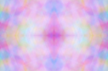 Abstract color pattern inside of kaleidoscope. Little pieces of light are mixed in one geometric ornament. Colorful vivid background. Seamless multicolored tile backdrop.