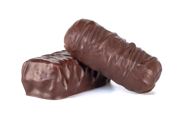 Whole dark brown delicious chocolate isolated on white background.