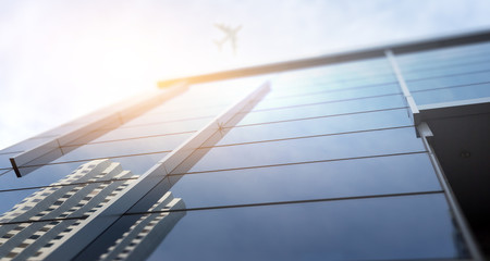 Airplane above business city . Mixed media © Sergey Nivens