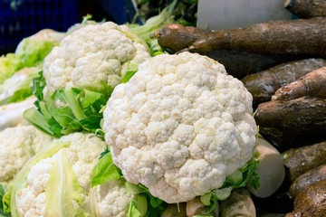 Fresh ripe cauliflowers on sale. Organic healthy food on the local market from rural farms 