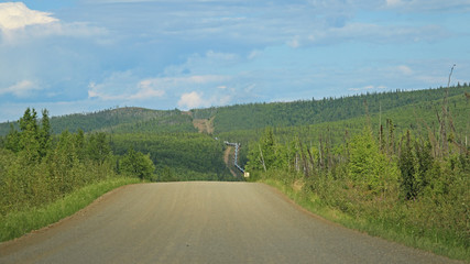 Dalton Highway running parallel to the Alaska Pipeline near the Arctic Circle