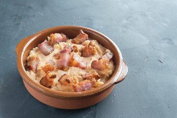 mashed potatoes with slice of bacon