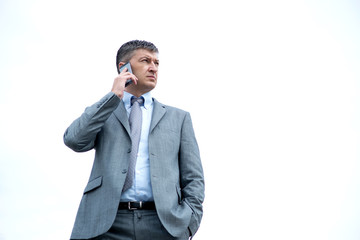 Businessman out of the office talking on his phone
