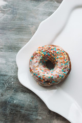 iced doughnut on a white plate