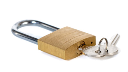 Metal padlock with keys on a ring isolated on white background