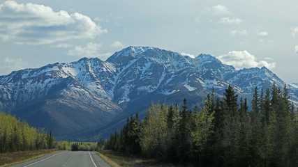 Alaska Highway with Nutzotin Mountains in the background - Alaska