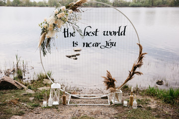 arch and decor for a wedding ceremony in the style of boho near the river