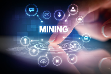 Finger touching tablet with web technology icons and MINING inscription, web technology concept