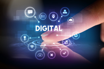 Finger touching tablet with web technology icons and DIGITAL inscription, web technology concept