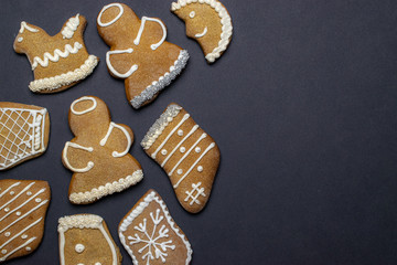 Gingerbread man. Xmas homemade Ginger, Honey cookies on dark background. Merry Christmas greeting card, banner. Winter holiday xmas theme. Happy New Year. Space for text