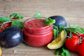 Homemade, fresh tomato plum sauce in a glass jar