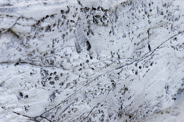 Background from closeup high detailed fragment textured of white stone wall a old building