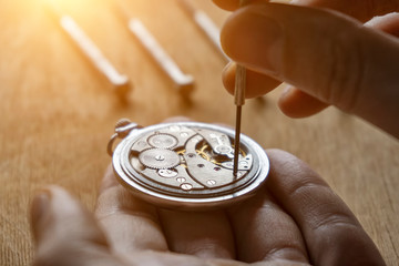 Watchmaker is repairing the wristwatch, mechanical watch