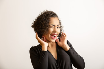 Beautiful afro woman smiling at the camera.